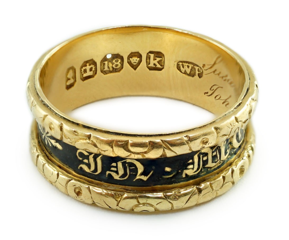 A George IV 18ct gold and black enamel 'In Memory Of' mourning band, with carved scroll border